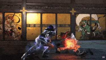 a video game is being played in front of a painting on the wall