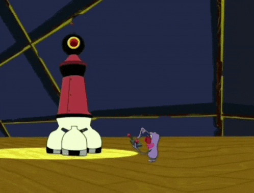 a cartoon character is standing next to a red cone and a black tire .