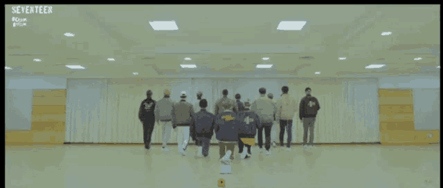 a group of people are dancing in a room with seventeen written on the bottom of the screen