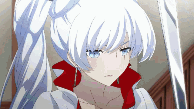 a girl with white hair and blue eyes is wearing earrings