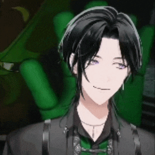 a man with black hair and purple eyes is sitting in front of a green chair and smiling .