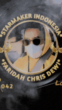 a starmaker indonesia logo with a man wearing sunglasses and a face mask