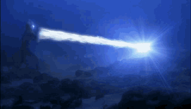 a blue background with a light coming out of the bottom