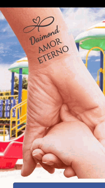a person has a tattoo on their wrist that says daimond amor eterno