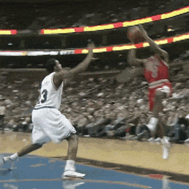 a basketball player in a white jersey with the number 3 on the back