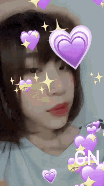 a girl with purple hearts and the word gn on the bottom right