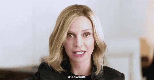 a close up of a woman 's face with a caption that says `` it 's overkill . ''