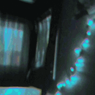 a blurred image of a room with blue lights