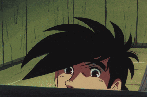 a close up of a person 's face with a surprised look on his face