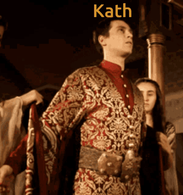 a man in a red and gold costume with the name kath on the bottom