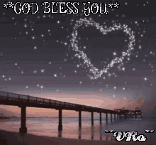 a picture of a pier with a heart made of stars and the words god bless you