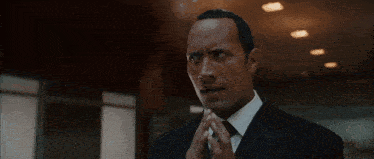 a man in a suit and tie says " don 't commit suicide "