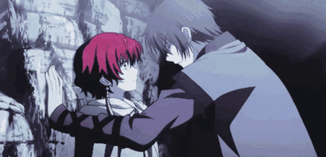 a man and a woman are hugging each other