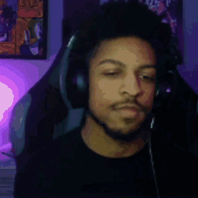 a person is sitting in a gaming chair with a purple light in the background