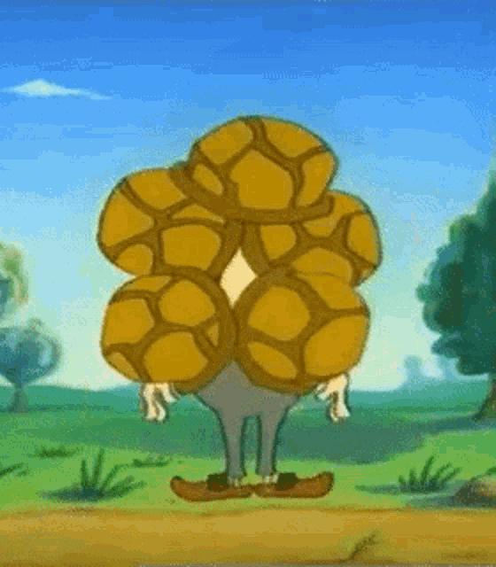 a cartoon character is wearing a hat and holding a snake on his head