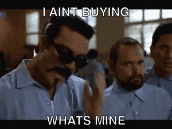 a man with a mustache and sunglasses says " i aint buying whats mine "