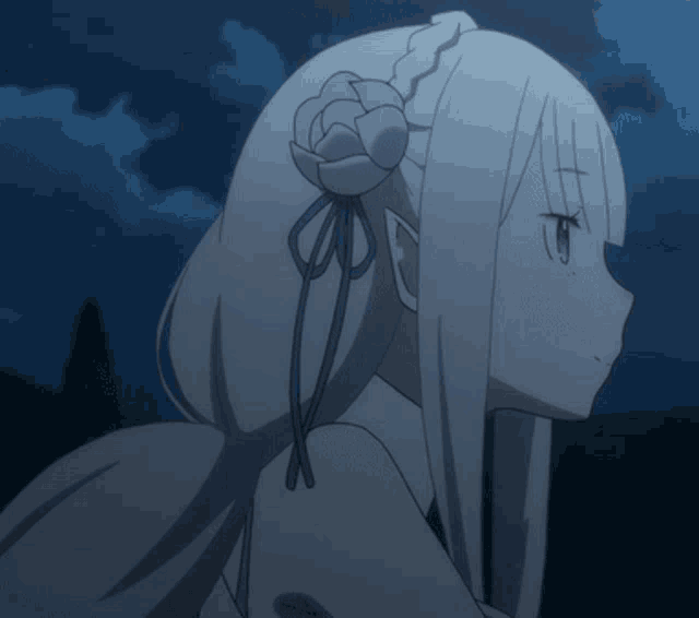 a girl with a flower in her hair looks to the side