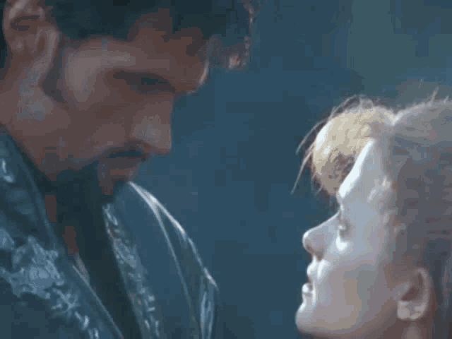 a man and a woman are looking at each other with the words i 'm ares above them