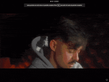 a man in a hooded jacket is driving a red sports car on a youtube page