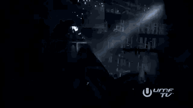 a black and white photo of a concert with the word umf tv in the corner