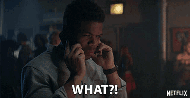 a man talking on a cell phone with the words " what " written below him