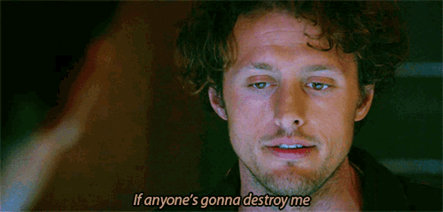 a man with curly hair and a beard says if anyone 's gonna destroy me