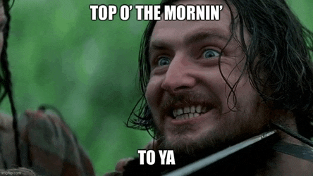a man with a beard is smiling and holding a sword in his mouth .