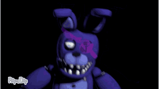 a purple stuffed animal with a purple eye and the words flipa clip on the bottom right