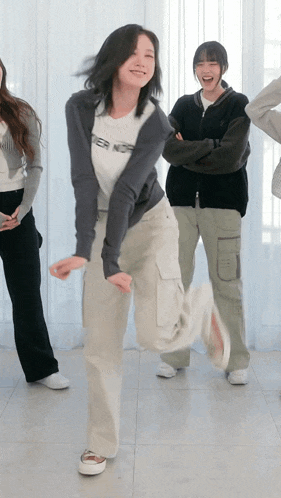 a woman wearing a white shirt that says ' ter nor ' on it