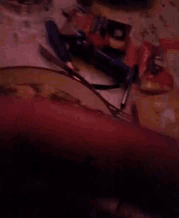 a blurred image of a person 's hand holding something