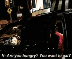 a man in a car is asking if he is hungry and wants to eat