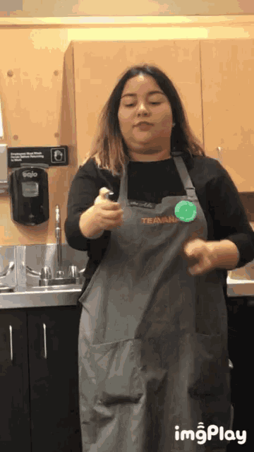 a woman wearing an apron that says ' train ' on it