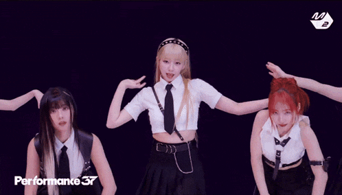 a girl in a white shirt and tie is dancing in front of a performance 37 banner