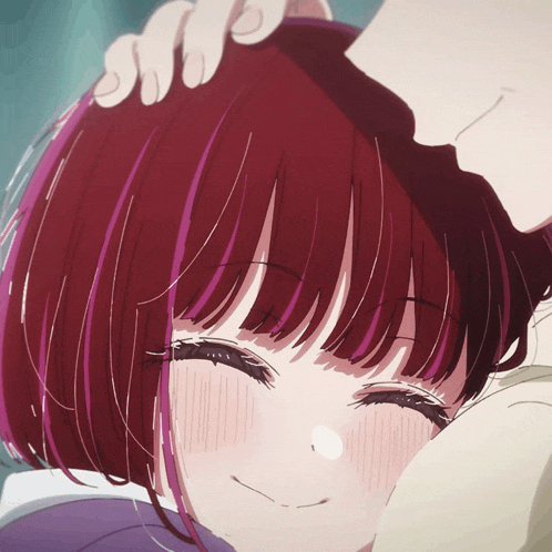 a close up of a girl 's face with red hair