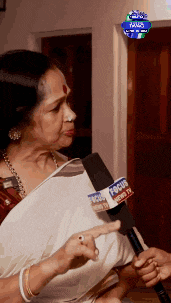 a woman talking into a microphone that says focus news tv on it