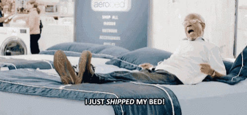 an elderly man laying on a bed with the words " i just shipped my bed " above him