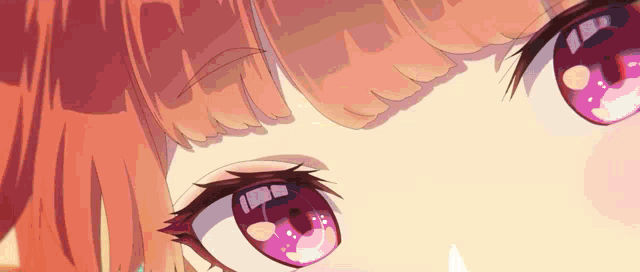 a close up of a girl 's eyes with a purple pupil