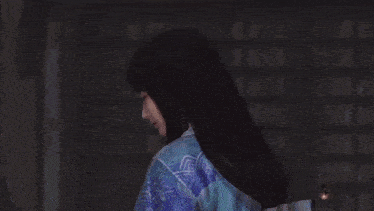a close up of a blue and white shirt with a floral pattern