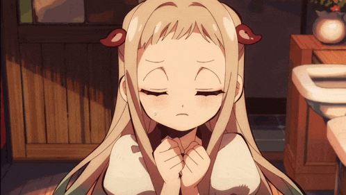 a girl with long blonde hair and red ears is making a sad face