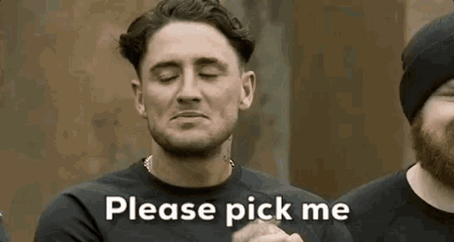 a man with his eyes closed is asking someone to pick him up .