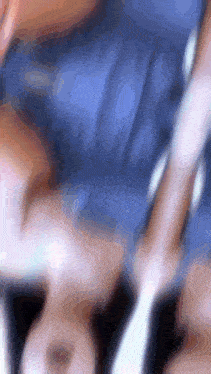 a blurry picture of a person laying on a couch