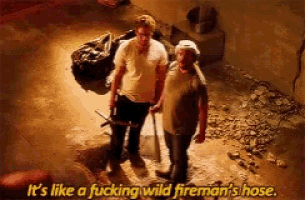 two men standing next to each other with the words it 's like a fucking wild fireman 's hose .