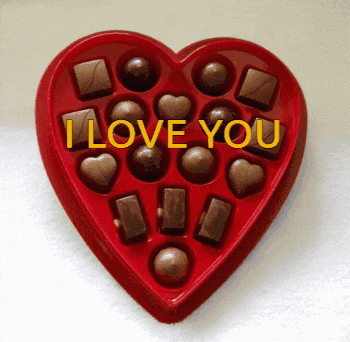 a heart shaped box of chocolates with the words i love you written on it