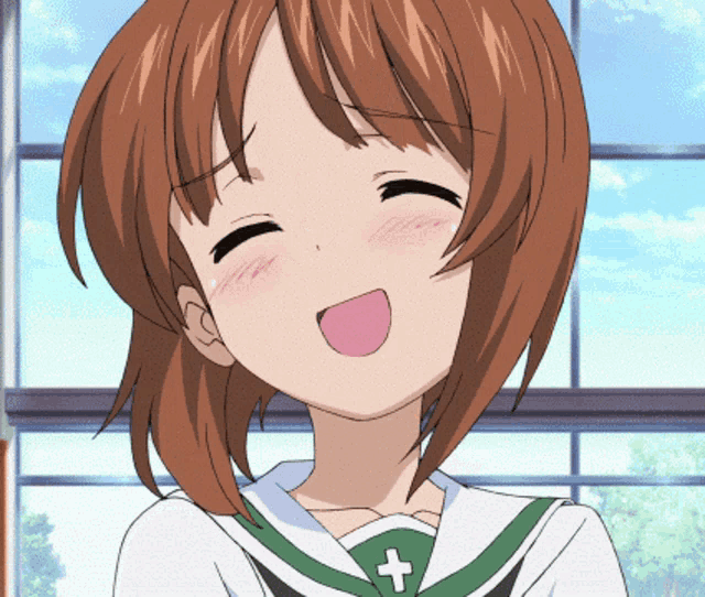 a girl with brown hair is smiling with her eyes closed and a cross on her shirt