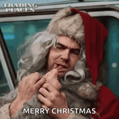 a man dressed as santa claus is sitting in a car eating a candy cane .