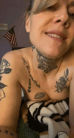 a woman with a tattoo on her chest that says ' always ' on it