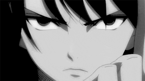 a close up of a person 's face with a serious look on their face