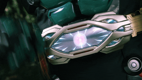 a close up of a futuristic device with a glowing light