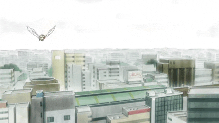 a bird is flying over a city with a sign on the roof that says ' a ' on it