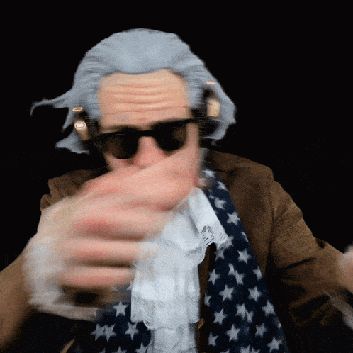 a man wearing a wig and sunglasses holds a glass in his hand